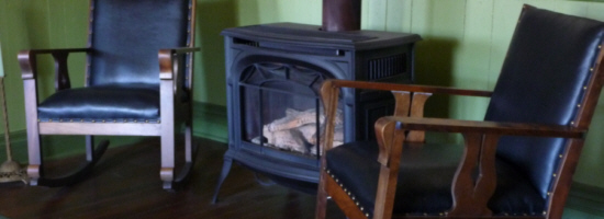 Relax by the wood stove in the lobby of the Dauphine Hotel